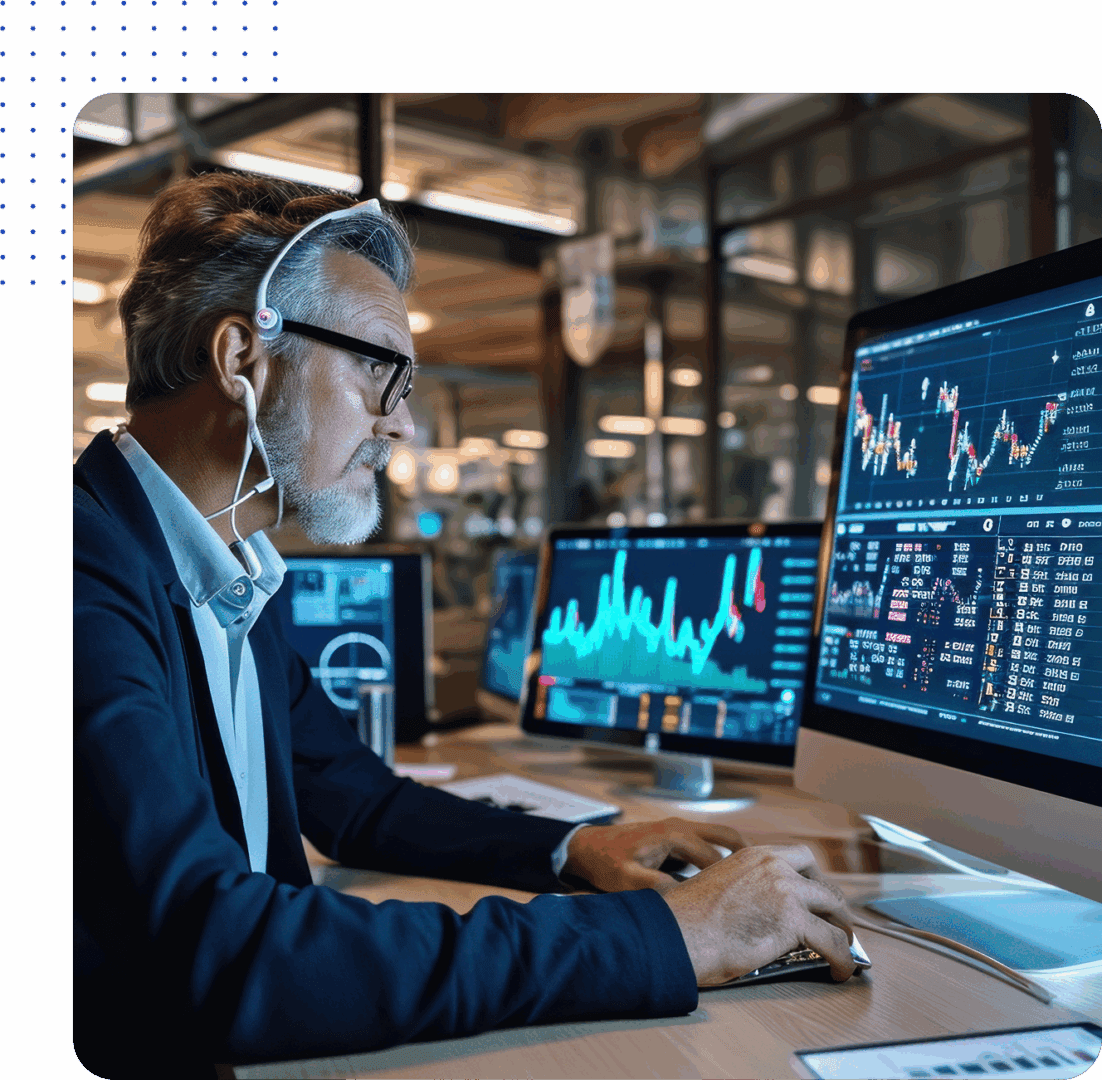 Man analyzing financial data on computer screens.