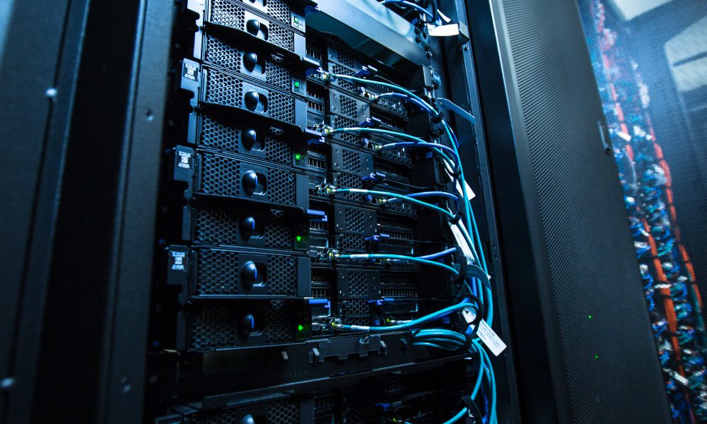 Server racks with cables and equipment.