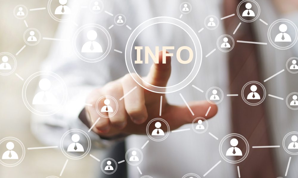 Finger pointing at digital information network.